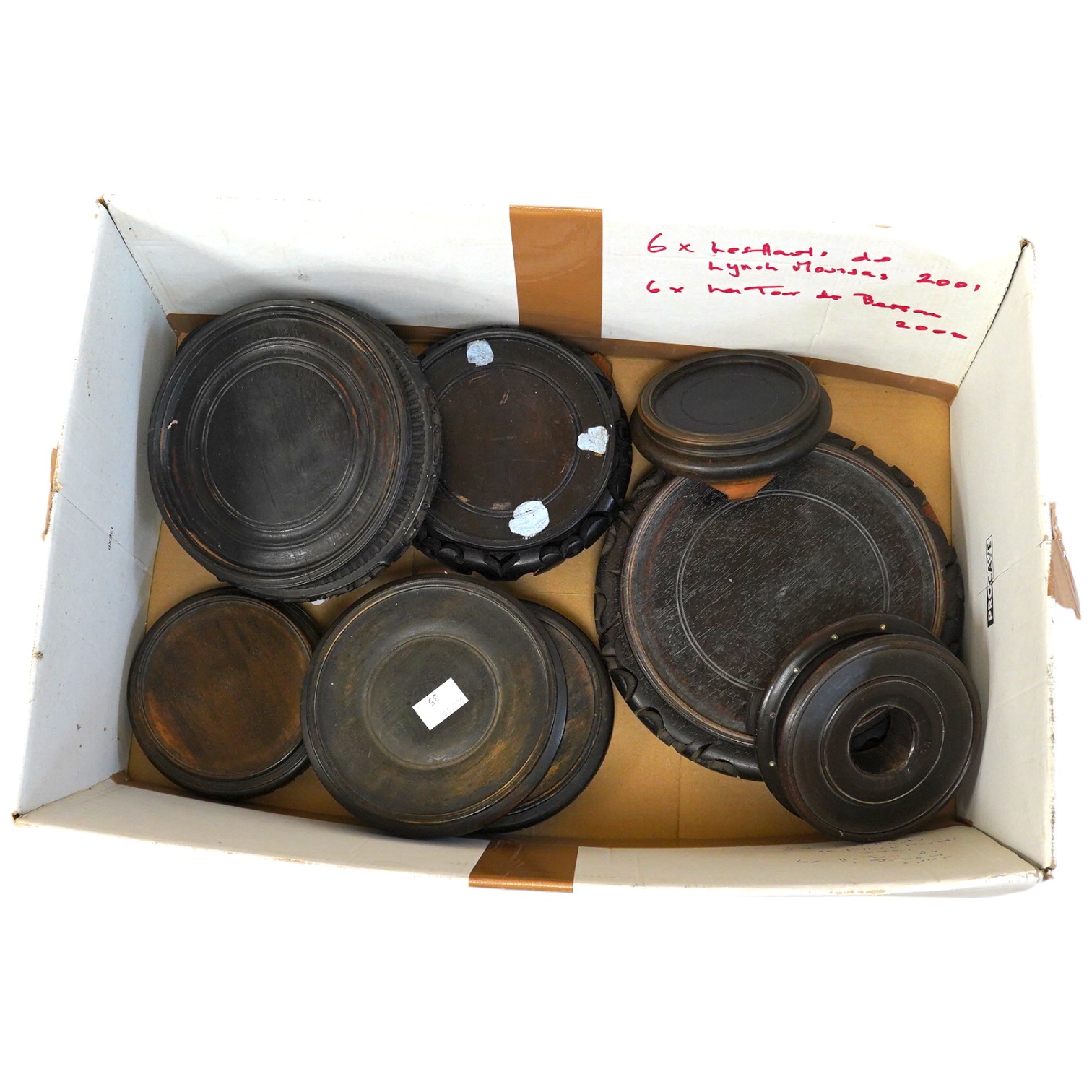 A group of Chinese hardwood stands largest 21cm in diameter. Condition - fair, some chips